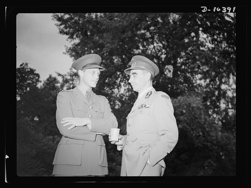 The uniforms are different but the cause is the same. Officers of the United Nations attend a garden party of the United Nations Club at Dumbarton Oaks, Sunday, September 6, 1942. Left to right: Colonel Drury, Royal Canadian Artillery; Colonel B. E. M. Diepenryck