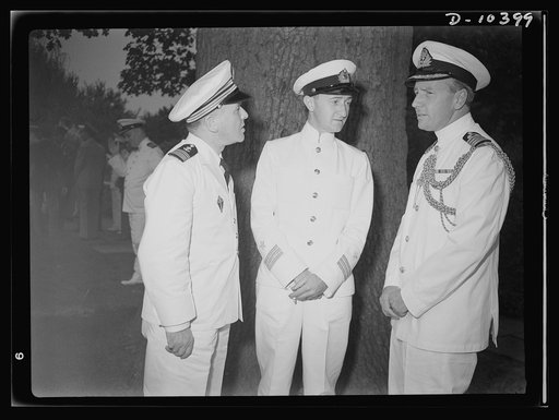 The uniforms are different but the cause is the same. Officers of the United Nations attend a garden party of the United Nations Club at Dumbarton Oaks, Sunday, September 6th, 1942. Left to right: Captain J. G. Gayral, France; Commander Skriagin, Russia; Captain W. Jameson, Assistant Naval Attache, 