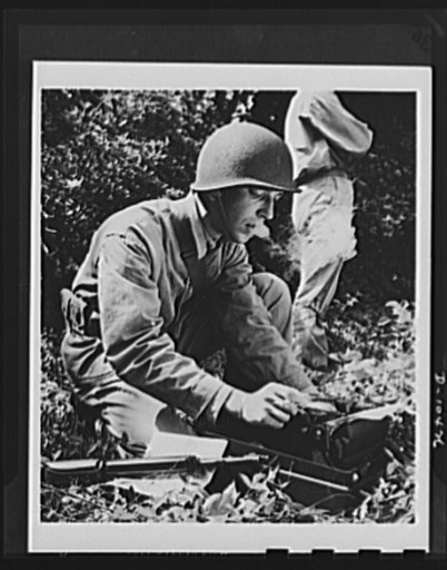Sergeant Sidney Epstein, former Washington Times-Herald reporter, types reports on the progress of maneuvers during basic training at the Marine Corps base at Parris Island, South Carolina. Sergeant Epstein is now serving as a fighting reporter in a combat area for the Division of Public Relations, 