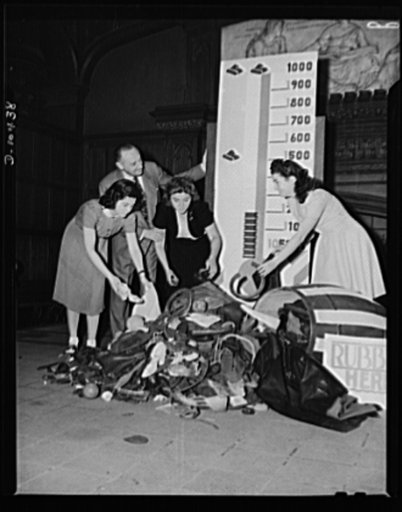 Washington Irving High at 15th and Irving Place, New York City, rubber salvage drive. Heeding the request of the President of the United States, high school girls of the Washington Irving Vocational School for Girls bring in the results a treasure hunt from attic to bedroom yielded in their own home