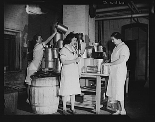 YWCA tea room workers at the 45th Street and Lexington Avenue home for nurses of the YWCA spend an entire hour or two each day after work to clean and process empty tins for city collection in nation-wide salvage drive. Photo shows left to right: Collette Burke, Anna Yesowite and Ruth Fingerald at w
