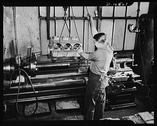 Lowering pressure valve housing on engine lathe