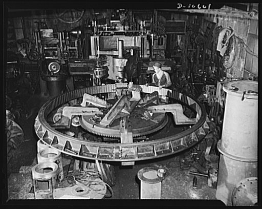 General view of Kearny Machine Works shop with gear cutting machine set up to cut teeth in gear for U.S. Navy battleship under construction