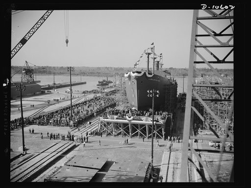 Launching of 10,000 ton ships. The first of 90 sister ships to be built for the Maritime Commission slides off the dock into the Atlantic. Launched just one year from the time construction work started on the shipyards, this 10,000 ton vessel is of the "Virginia Dare" type. In the future these ships