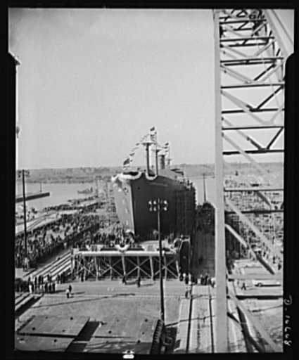 Launching of 10,000 ton ships. The first of 90 sister ships to be built for the Maritime Commission slides off the dock into the Atlantic. Launched just one year from the time construction work started on the shipyards, this 10,000 ton vessel is of the "Virginia Dare" type. In the future these ships