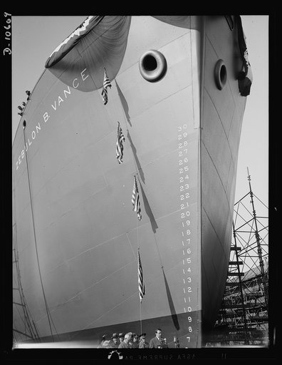 Launching of 10,000 ton ships. The first of 90 sister ships to be built for the Maritime Commission slides off the dock into the Atlantic. Launched just one year from the time construction work started on the shipyards, this 10,000 ton vessel is of the "Virginia Dare" type. In the future these ships