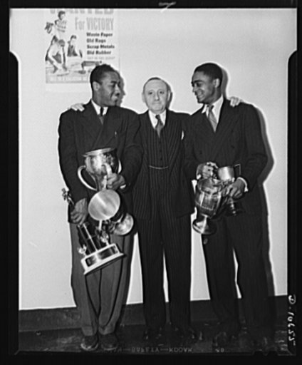 Left to right: John Borican, track star; Clarence H. Low; amd James Herbert, track star
