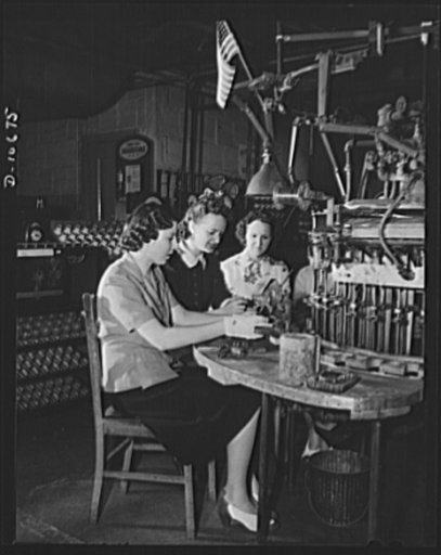 Mary Petillo, forelady of a Newark, New Jersey factory making lamp bulbs and tubes for the Signal Corps, is an active member of her plant's laboratory management committee. The committee, set up in cooperation with the War Production Board's drive to speed victory, was elected in Mary's plant from a