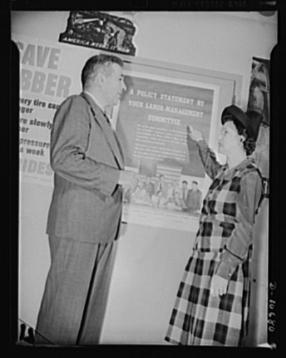Left to right: Michael W. Straus, Chief, War Production Drive Headquarters, and Mrs. Marie McPherson, Chairman, Labor Mangagement Committee, Meissner Manufacturing Company, Mount Carmel, Illinois