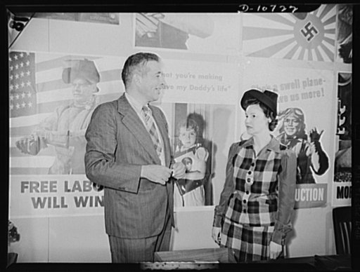 Left to right: Michael W. Straus, Chief of War Production Drive Headquarters; Mrs. Marie McPherson, Chairman, Labor-Management Committee, Meissner Manufacturing Company, Mount Carmel Illinois