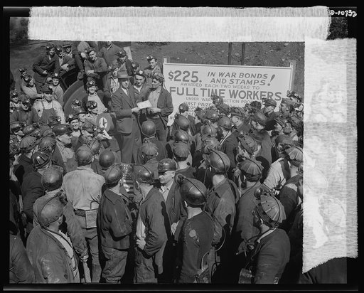 War production drive. Anthracite rallies. A lucky miner who received a 100 dollar war bond at one of the four anthracite miners' rallies in Eastern Pennsylvania on September 28th through October 1st. Only miners with one-hundred-percent work attendance could participate in the drawing
