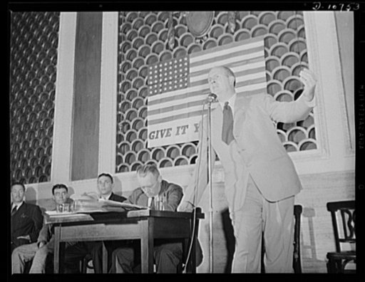 Alex G. Nordholm, Chief, Regional Service, War Production Drive Headquarters, speaking before labor-management committee members at Scranton, July 29th. Seated left to right: Earl Williams, Dmitri Goulandris and Michael J. Kosik