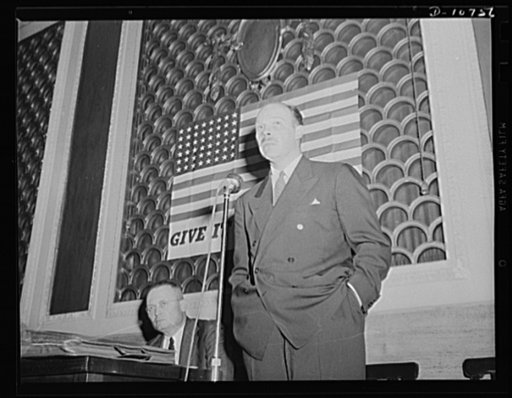 Frank C. Wright, Jr., Washington representative for the anthracite industry, speaking before labor-management committee members at Scranton, July 29th. Michael J. Kosik, seated