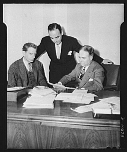 Left to right: Dr. John S. Sly, Regional Price Administrator, Office of Price Administration; A. Antolini, Associate Regional Price Administrator; Sylvan Joseph, Regional Price Director OPA