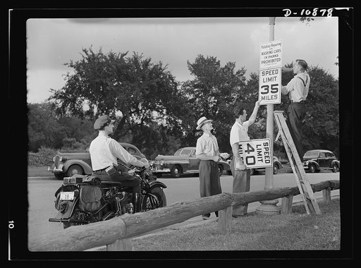 Full speed ahead--Victory style. Speeding is out for the duration. In Washington, D.C., speed limits were lowered from 40 miles per hour to 35 within 24 hours after the Baruch Rubber Investigating Committee recommended the lower speed on a nationwide basis. Photo shows new sign being erected