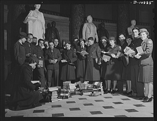 Victory Book Campaign. Soldiers of Fort Myer, Virginia, and volunteer service members of the Red Cross in the Capitol, receive books donated by members of Congress for the armed forces
