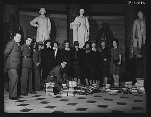Victory Book Campaign. Soldiers of Fort Myer, Virginia and ladies of the Red Cross at Staturary Hall in the Capitol at ceremonies at which members of Congress contributed books for the 1943 Victory Book Campaign