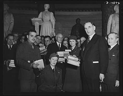 Victory Book Campaign. At ceremonies in Statuary Hall at the Capitol at which members of Congress contributed books for the Victory Book Campaign. Congressmen shown holding books are Representative George A. Dondero of Michigan; Allen Treadway, Massachusetts and Representative John McCormack, Massac
