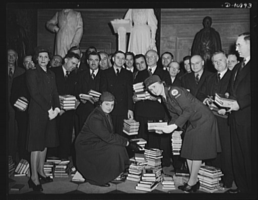 Victory Book Campaign. Members of Congress donating books to American Red Cross volunteers for the 1943 Victory Book Campaign. Congressmen shown holding books are (left to right), Representative Aime J. Forland, Rhode Island; Representative Ralph Church of Illinois; Representative Thomas D'Alesandro