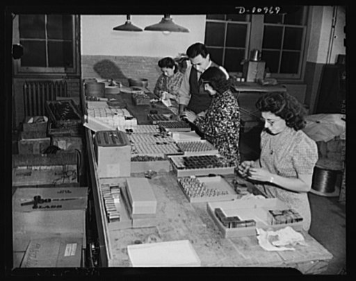 Conversion (auto accessory plant). Photo shows girl workers at a New York City plant assembling field sterilizers for the United States Army Medical Corps.  Sol Lapides, partner in the firm inspects work. This firm formerly engaged in the manufacture of automobile accessories. Since converted ninety