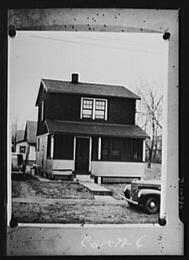 Conversion. From garage to defense workshop. This is the exterior of the Carell home. The side door admits authorized visitors to the war shop. A stenciled sign warns off others to stay out