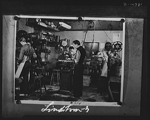 Conversion. From garage to defense workshop. John Lindstrom produces war goods in his garage converted somewhere in New Jersey into a busy machine shop