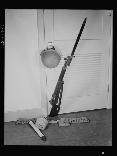 Helmet and Garand rifle