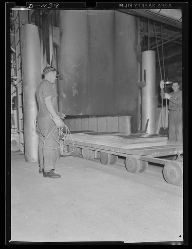 Aluminum. Reynolds Metal Company, Louisville, Kentucky. Rolled "strong alloy" akynubym sheet being placed in annealing oven. This sheet stock is of vital importance to the defense program in the manufacture of airplanes