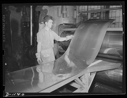 Aluminum. Reynolds Metal Company, Louisville, Kentucky. Flattening sheet aluminum after heat treatment. This flattening operation is most important in the production of aluminum sheet for use in airplane manufacture