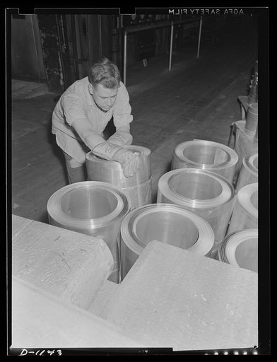 Aluminum. Reynolds Metal Company, Louisville, Kentucky. Coils of sheet aluminum which will soon be stamped into powder cans