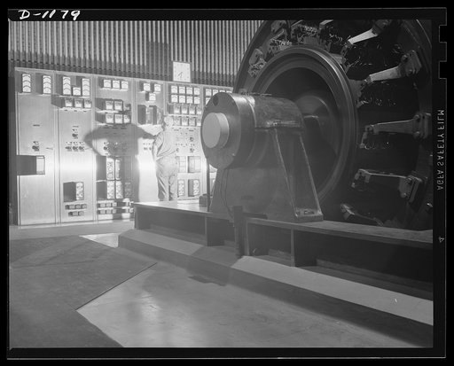 Steel manufacture, Allegheny-Ludlum. To the left is a portion of the panels containing metering devices and to record the operations of generators such as this, which power a rolling mill