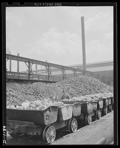 Steel manufacture, Allegheny-Ludlum. Here is a row of charging boxes loaded with limestone, the main ingrediant in the production of quality steel. These boxes will shortly dump their loads into open hearth furnaces