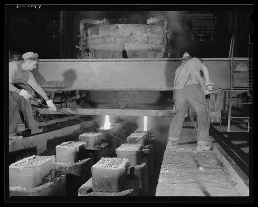 Steel manufacture, Allegheny-Ludlum. Ladling it out! These workers are casting ingots from the ladle into which a thirty-five ton electric furnace has just poured its molten steel. The "hot tops" allow for shrinkage of the steel in the ingots bodies. If these should be any slag left in the molten st