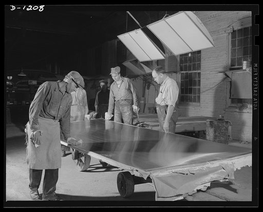 Steel manufacture, Allegheny-Ludlum. Sheets of finished stainless steel on their way to the warehouse and shipping rooms. All stainless steel for defense production is subject to rigorous inspection before acceptance