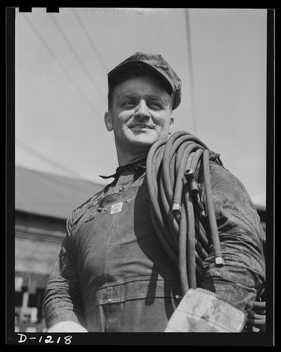 Steel manufacture, Allegheny-Ludlum. Here is one of the men upon whom depends the success of our effort to produce for the boys in uniform. He is a steel mill maintenance man on his way to repair a breakdown. It's his job to see to it that nothing interferes with our defense production