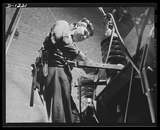 Steel manufacture, Allegheny-Ludlum. The production of many tons of high quality steel depends on the efficiency with which this electrician installs the power lines to new transformers used in conjunction with electric furnaces