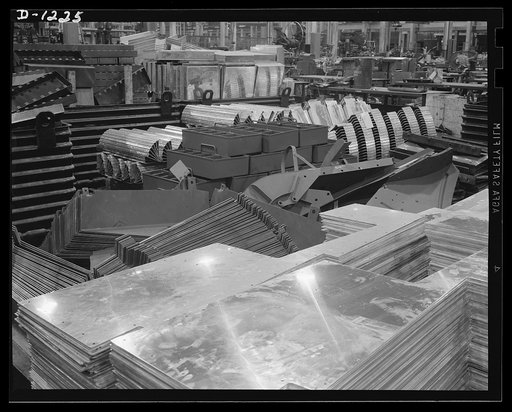 Tank manufacture (Chrysler). These are miscellaneous stampings for M-3's the twenty-eight ton tanks being produced at the huge Chrysler tank arsenal in Detroit. The pile includes ammunition racks, tool boxes and instrument panels