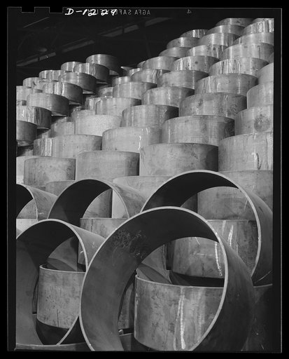 Tank manufacture (Chrysler). Stockpiles such as these need constant replenishment now that M-3 tanks have reached a mass production schedule. These are wheel suspension lever forgings, stored outside the huge Chrysler tank arsenal in Detroit where 10,000 workers are turning out 28 ton rolling arsena