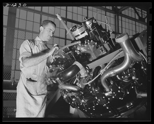 Tank manufacture (Chrysler). The carburator is installed before this 400 horsepower Wright Whirlwind engine is placed in one of the Army's huge   M-3 tanks. This mechanic is employed at the Chrysler tank arsenal, on the outskirts of Detroit, where these twenty-eight ton tanks are being made