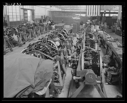 Tank manufacture (Chrysler). M-3s, the twenty-eight ton "medium" tanks being turned out in Detroit at the Chrysler tank arsenal, are powered by nine cylinder, 400 horsepower Wright Whirlwind aviation type engines. This is a general view of the final engine assembly department