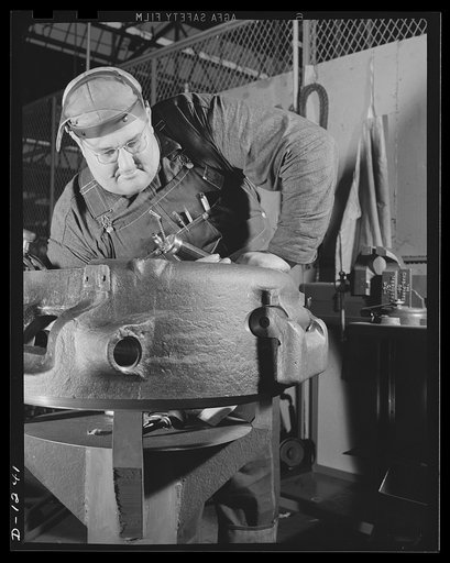 Tank manufacture (Chrysler). Ten thousand skilled workers are turning out twenty-eight ton M-3 tanks at the huge Chrysler tank arsenal in Detroit. This man is checking the sub-assembly of a cupola to be installed on the top of a gun turret of one of these rolling arsenals