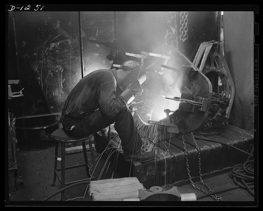 Tank manufacture (Chrysler). Expert welders are important to Uncle Sam's defense industries. Not only are welded connections as strong as, or stronger than, riveted connections, but they mean a saving steel and in overall weight. This welder is working on the engine support assembly of an M-3 tank a