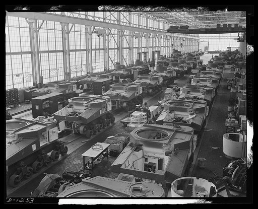 Tank manufacture (Chrysler). These are partially completed M-3 tanks, twenty-eight ton steel giants being turned out at the huge Chrysler tank arsenal in Detroit. The camera was directed toward the end of the three main assembly lines. Mass assembly methods developed in automobile manufacture are us