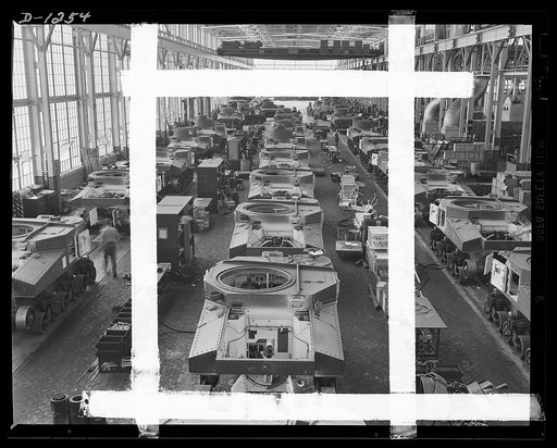 Tank manufacture (Chrysler). These are partially completed M-3 tanks, twenty-eight ton steel giants being turned out at the huge Chrysler tank arsenal in Detroit. The camera was directed toward the end of the three main assembly lines. Mass assembly methods developed in automobile manufacture are us
