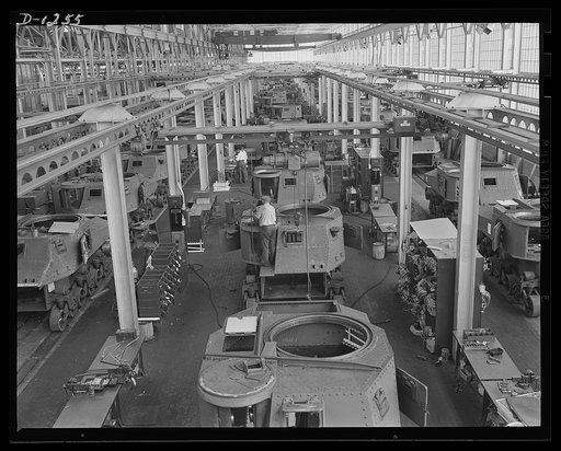 Tank manufacture (Chrysler). These are partially completed M-3 tanks, twenty-eight ton steel giants being turned out at the huge Chrysler tank arsenal in Detroit. The camera was directed toward the end of the three main assembly lines. Mass assembly methods developed in automobile manufacture are us