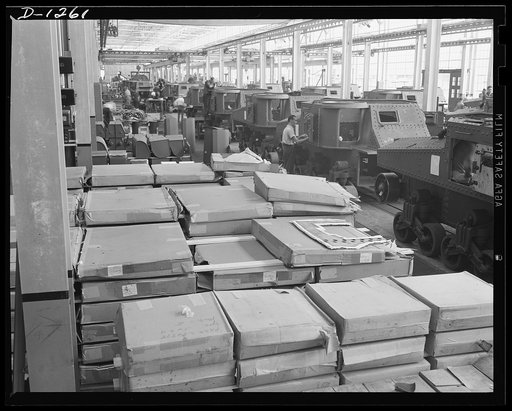 Tank manufacture (Chrysler). These are partially completed M-3 tanks, twenty-eight ton steel giants being turned out at the huge Chrysler tank arsenal in Detroit. The camera was directed toward the end of the three main assembly lines. Mass assembly methods developed in automobile manufacture are us
