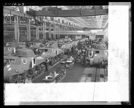 Tank manufacture (Chrysler). These are partially completed M-3 tanks, thirty-eight ton steel giants being turned out at the huge Chrysler tank arsenal in Detroit. The camera was directed toward the end of the three main assembly lines. Mass assembly methods developed on automobile manufacture are us