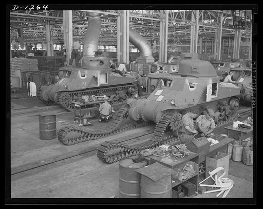Chrysler tank arsenal. Workers in the huge tank Chrysler arsenal near Detroit, putting the tracks on one of the giant M-3 tanks. These rolling arsenals weigh twenty-eight tons, are capable of speeds over twenty-five miles an hour and are equipped with 75 mm. field artillery gun and a 37 mm. anti-air