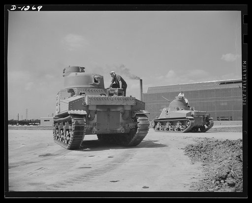 Chrysler tank arsenal. Off for a trial run. Each completed M-3 tank gets a 75 mile test run over all sorts of rough terrain. The proving ground adjoins the huge Chrysler tank arsenal near Detroit, where these twenty-eight ton behemoths are produced. The view is of the rear of a tank