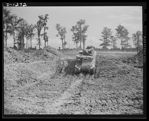 Chrysler tank arsenal. Off for a trial run. Each completed M-3 tank gets a seventy-five mile test run over all sorts of rough terrain. The proving ground adjoins the huge Chrysler tank arsenal near Detroit where these twenty-eight ton behemoths are produced